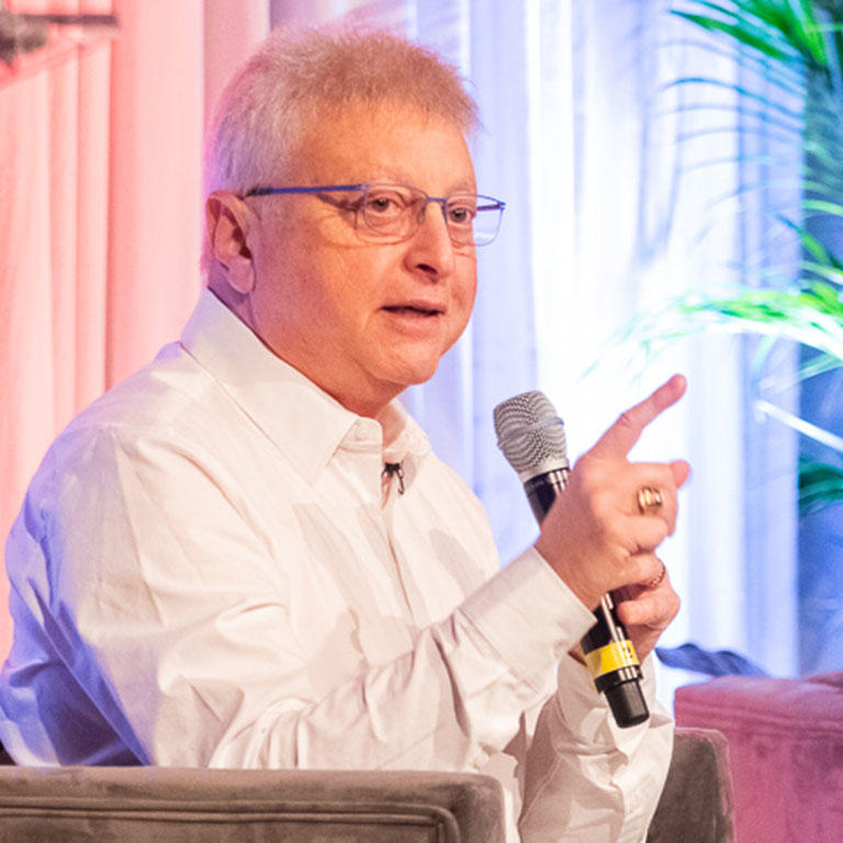 Man pressenting, and speaking into microphone